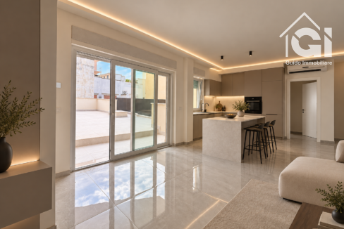 Cucina taupe con isola in pietra